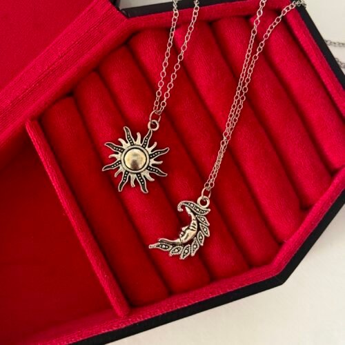 2 matching sun and moon necklaces