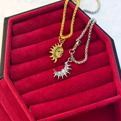 two vinatge matching sun and moon necklaces